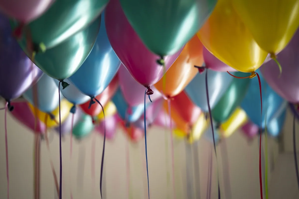 Joyful celebration with guests raising glasses