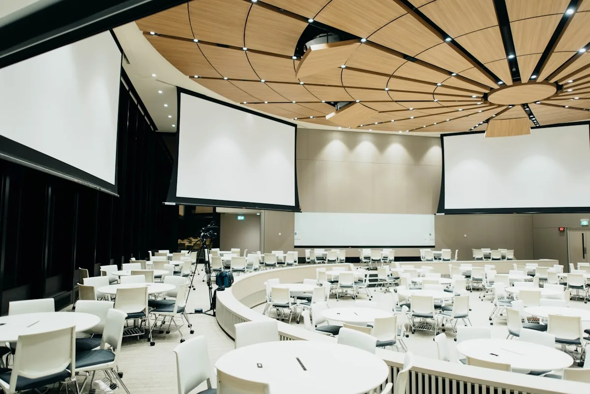 Corporate gala with elegant lighting and round tables